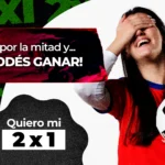 Banner promocional donde se muestra a una mujer con camiseta deportiva sosteniendo un balón de fútbol bajo el brazo, sonriendo con un gesto de alivio mientras cubre sus ojos con la mano y se incluyen los textos:  "El año va por la mitad y... ¡AÚN PODÉS GANAR!" junto con la frase "Quiero mi 2x1".